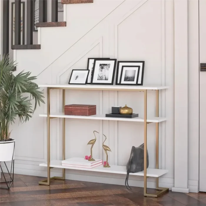 calix – golden metallic frame console table with geometric legs