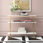 calix – golden metallic frame console table with geometric legs