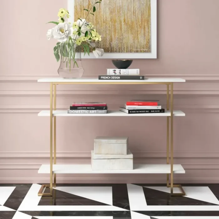 calix – golden metallic frame console table with geometric legs