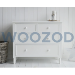 White mid-century chest of drawers with four drawers by Woozod Furniture.