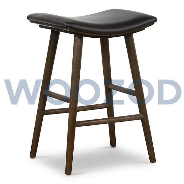 Union saddle stool with warm wood frame and saddle-style seat by Woozod Furniture.